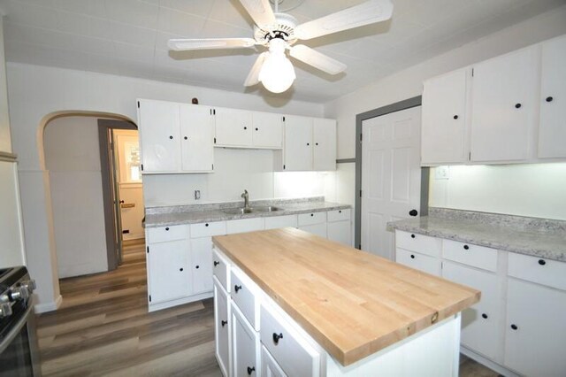 3736 E Edgerton Ave, Cudahy, WI 53110 - kitchen with white cabinets, gas stove, dark wood-style flooring, and a sink