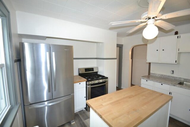 3736 E Edgerton Ave, Cudahy, WI 53110 - kitchen featuring dark wood-style flooring, white cabinetry, stainless steel appliances, and wooden counters