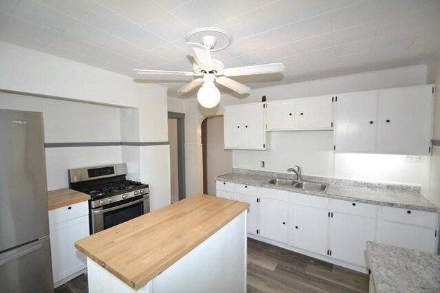 3736 E Edgerton Ave, Cudahy, WI 53110 - kitchen featuring white cabinetry, wooden counters, stainless steel appliances, and a sink