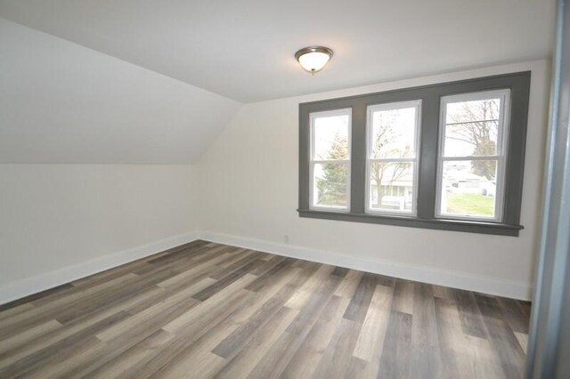 3736 E Edgerton Ave, Cudahy, WI 53110 - additional living space featuring wood finished floors, baseboards, and vaulted ceiling