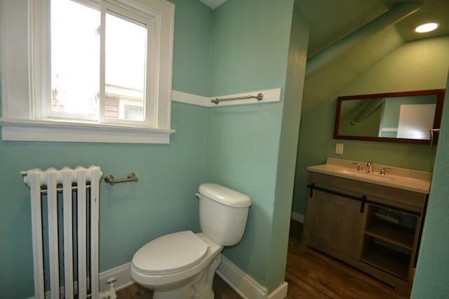 3736 E Edgerton Ave, Cudahy, WI 53110 - half bath featuring radiator heating unit, wood finished floors, baseboards, and toilet