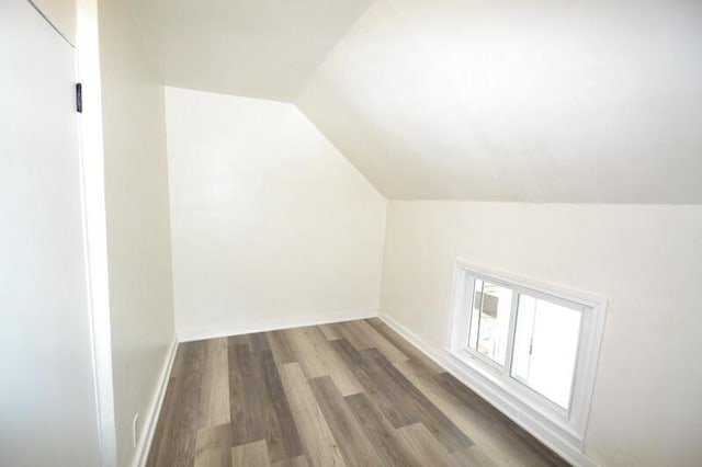 3736 E Edgerton Ave, Cudahy, WI 53110 - additional living space featuring baseboards, vaulted ceiling, and wood finished floors