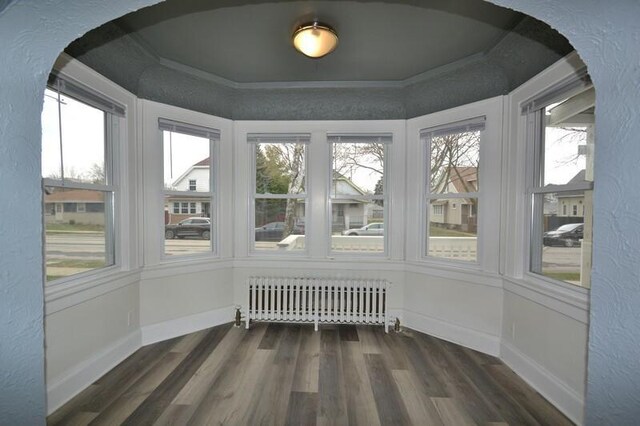 3736 E Edgerton Ave, Cudahy, WI 53110 - sunroom with radiator, baseboards, and wood finished floors