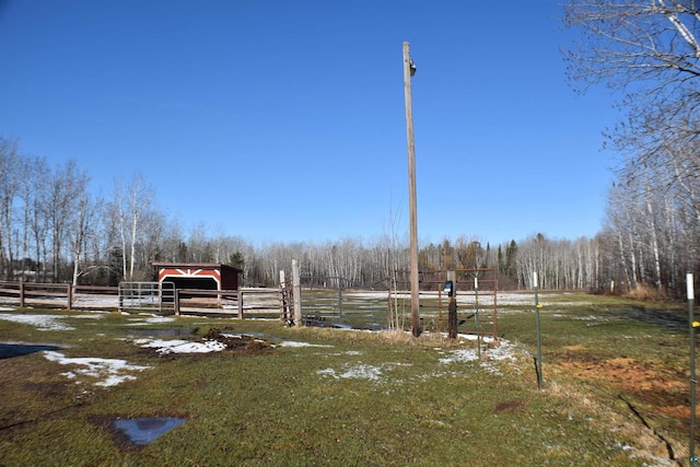 71435 Range Line Rd, Iron River, WI 54847 - view of yard featuring a view of trees, an outbuilding, and fence