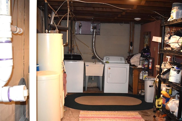 71435 Range Line Rd, Iron River, WI 54847 - clothes washing area featuring independent washer and dryer, gas water heater, a sink, and laundry area