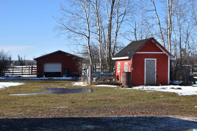 71435 Range Line Rd, Iron River, WI 54847 - snow covered structure with fence and an outdoor structure