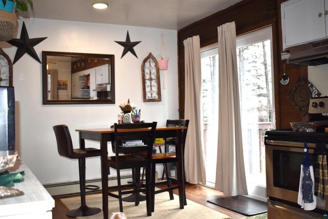 71435 Range Line Rd, Iron River, WI 54847 - dining space featuring recessed lighting, wood finished floors, and baseboard heating