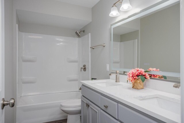2941 Chapel Ln, Mount Pleasant, WI 53406 - full bath featuring shower / bathing tub combination, double vanity, toilet, and a sink