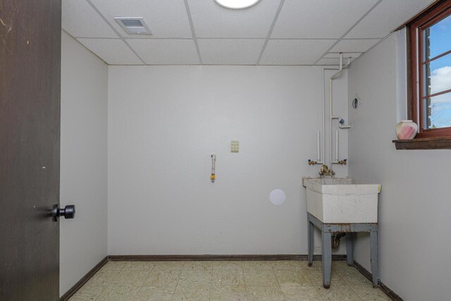 2941 Chapel Ln, Mount Pleasant, WI 53406 - clothes washing area with baseboards, tile patterned floors, and visible vents