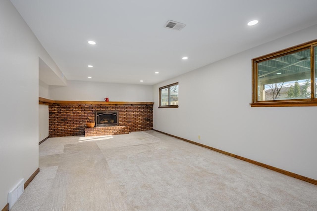 2941 Chapel Ln, Mount Pleasant, WI 53406 - basement featuring a fireplace, visible vents, light carpet, and recessed lighting