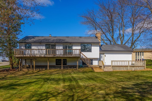 2941 Chapel Ln, Mount Pleasant, WI 53406 - rear view of house featuring a wooden deck, stairs, a chimney, and a yard