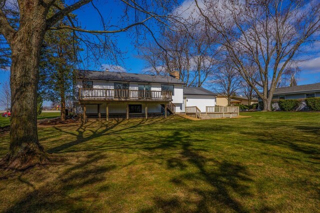 2941 Chapel Ln, Mount Pleasant, WI 53406 - back of property with a yard, a chimney, a deck, and stairs