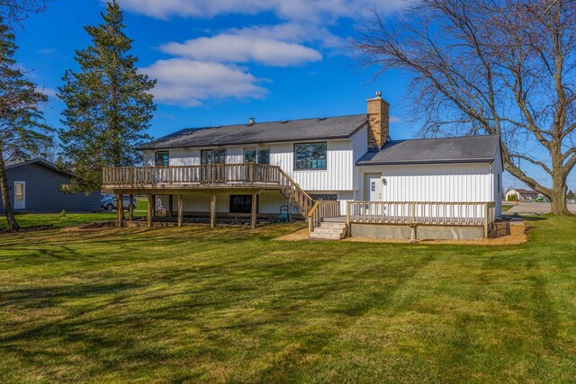 2941 Chapel Ln, Mount Pleasant, WI 53406 - rear view of property featuring a chimney, a deck, stairs, and a lawn