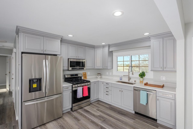 2941 Chapel Ln, Mount Pleasant, WI 53406 - kitchen featuring light countertops, appliances with stainless steel finishes, recessed lighting, and a sink