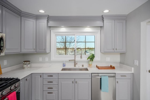 2941 Chapel Ln, Mount Pleasant, WI 53406 - kitchen with a sink, gray cabinets, stainless steel appliances, light countertops, and recessed lighting