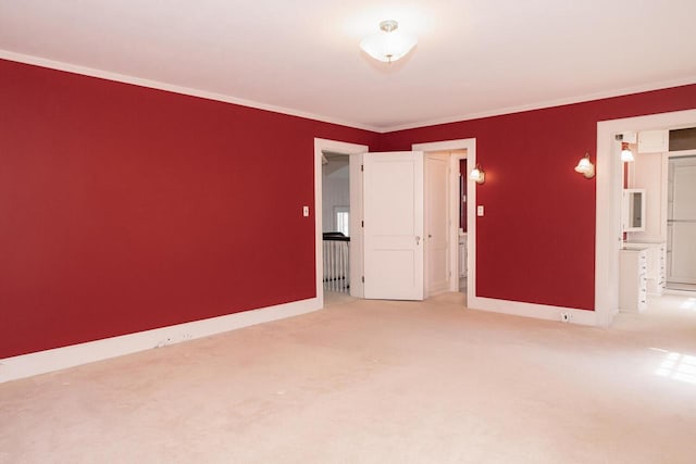 328 Wilson St, Winona, MN 55987 - empty room featuring carpet, baseboards, and ornamental molding