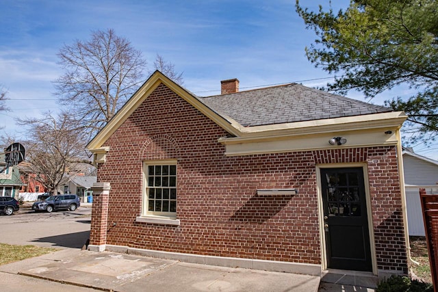 328 Wilson St, Winona, MN 55987 - view of front of house with a chimney and brick siding