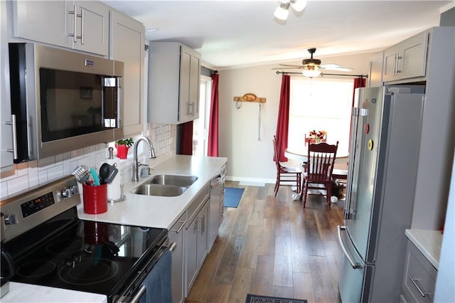 12188 Old Trl, Wisconsin Rapids, WI 54494 - kitchen featuring stainless steel appliances, gray cabinetry, plenty of natural light, and light countertops