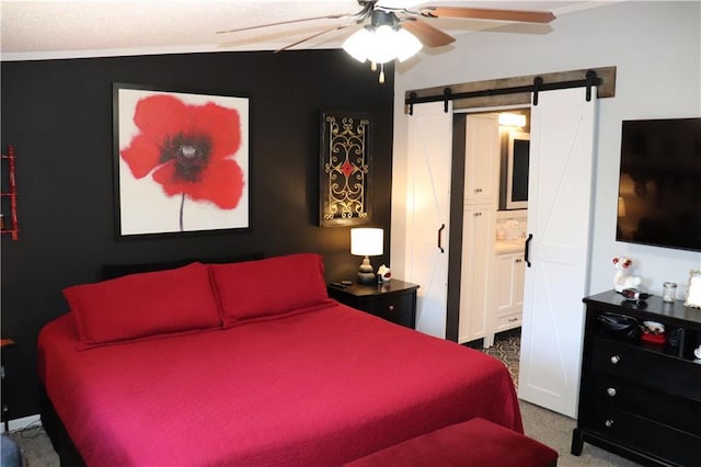 12188 Old Trl, Wisconsin Rapids, WI 54494 - bedroom featuring carpet flooring, a barn door, ensuite bath, and ceiling fan