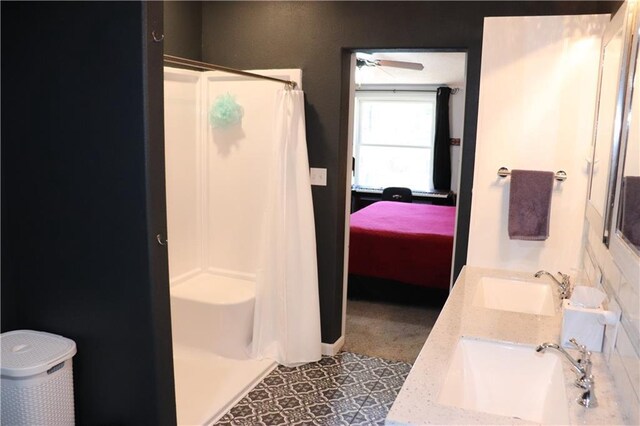 12188 Old Trl, Wisconsin Rapids, WI 54494 - full bathroom with a stall shower, ensuite bath, double vanity, and a ceiling fan