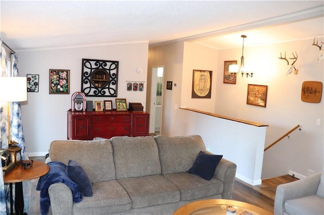 12188 Old Trl, Wisconsin Rapids, WI 54494 - living room with a chandelier, crown molding, and dark wood-style floors