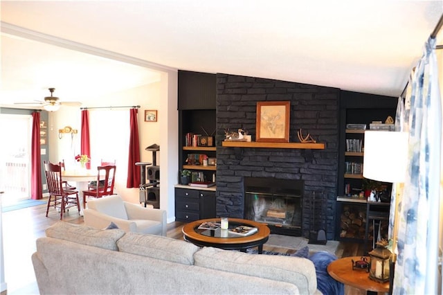 12188 Old Trl, Wisconsin Rapids, WI 54494 - living room with wood finished floors, a stone fireplace, ceiling fan, and built in features