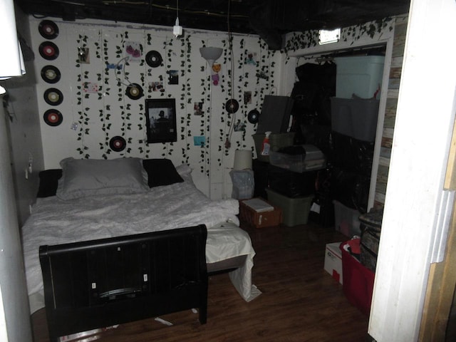bedroom with wood finished floors