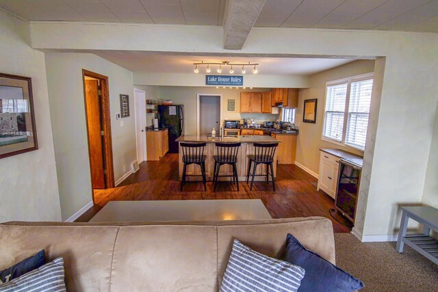 N4142 Sleepy Hollow Rd, Cambridge, WI 53523 - interior space featuring wine cooler, baseboards, and dark wood-style floors