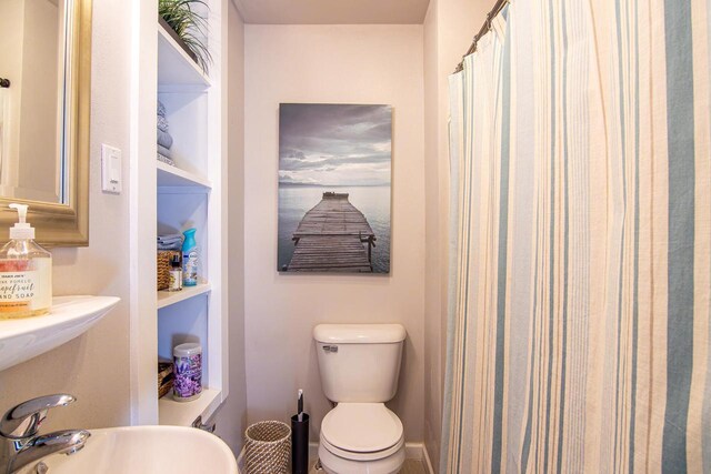 N4142 Sleepy Hollow Rd, Cambridge, WI 53523 - bathroom with curtained shower and toilet