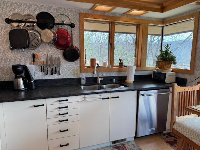bar with dishwasher and a sink