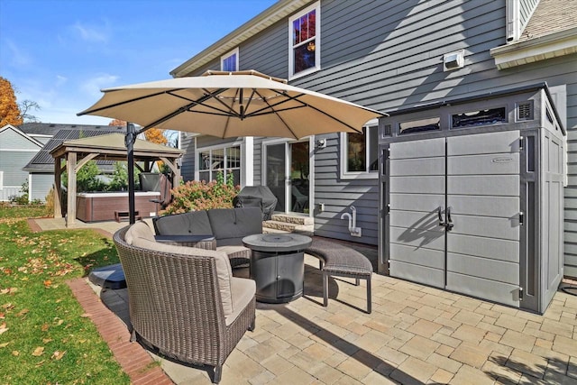 1549 Cambridge Ct, Hubertus, WI 53033 - view of patio featuring a gazebo, an outdoor fire pit, a hot tub, and a grill