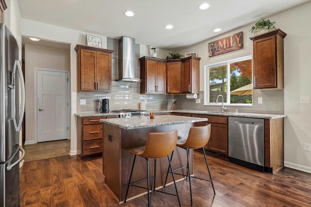 1549 Cambridge Ct, Hubertus, WI 53033 - kitchen featuring a center island, a sink, stainless steel appliances, dark wood finished floors, and wall chimney exhaust hood