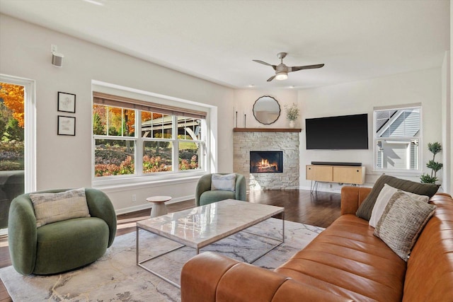 1549 Cambridge Ct, Hubertus, WI 53033 - living area with a fireplace, plenty of natural light, wood finished floors, and ceiling fan