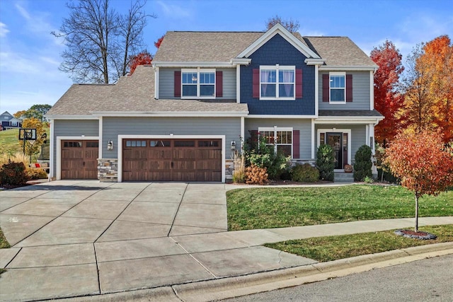 1549 Cambridge Ct, Hubertus, WI 53033 - craftsman-style house with a garage, driveway, stone siding, and a front lawn
