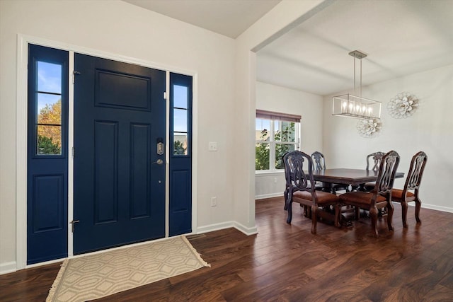 1549 Cambridge Ct, Hubertus, WI 53033 - foyer with baseboards, dark wood-style flooring, and a chandelier