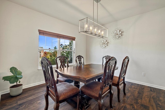 1549 Cambridge Ct, Hubertus, WI 53033 - dining room featuring wood finished floors, baseboards, and an inviting chandelier