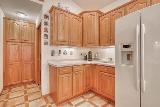 864 Chief Kewaskum Pl, Kewaskum, WI 53040 - kitchen featuring light countertops, white refrigerator with ice dispenser, and baseboards