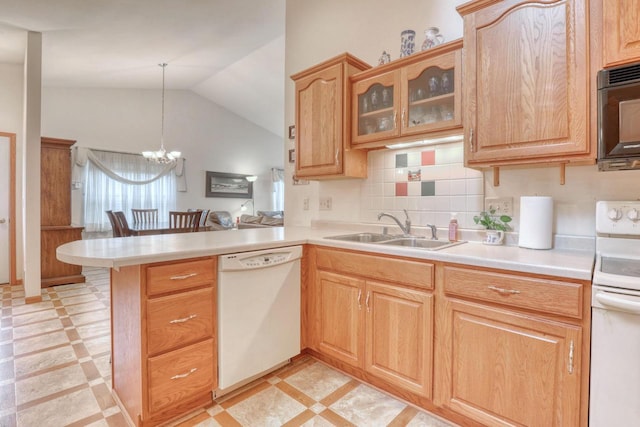 864 Chief Kewaskum Pl, Kewaskum, WI 53040 - kitchen with lofted ceiling, light countertops, a sink, white appliances, and a peninsula