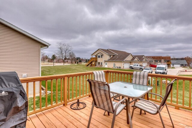 864 Chief Kewaskum Pl, Kewaskum, WI 53040 - wooden terrace featuring a playground, outdoor dining space, a grill, a yard, and a residential view