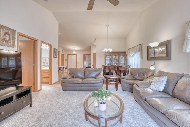 864 Chief Kewaskum Pl, Kewaskum, WI 53040 - living area with ceiling fan with notable chandelier, high vaulted ceiling, and light colored carpet