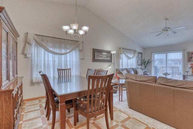 864 Chief Kewaskum Pl, Kewaskum, WI 53040 - dining area featuring ceiling fan with notable chandelier, baseboards, and high vaulted ceiling