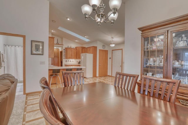 864 Chief Kewaskum Pl, Kewaskum, WI 53040 - dining space with vaulted ceiling, an inviting chandelier, and recessed lighting