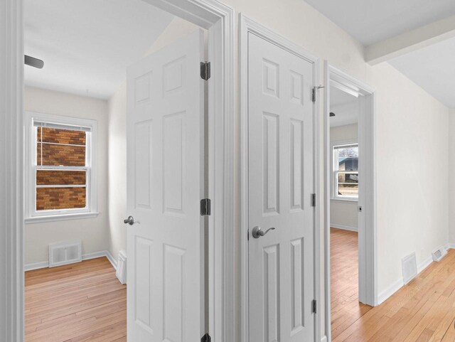 7509 W Burleigh St, Milwaukee, WI 53210 - hallway featuring light wood finished floors, baseboards, and visible vents