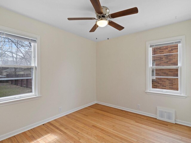 7509 W Burleigh St, Milwaukee, WI 53210 - spare room featuring light wood finished floors, baseboards, a ceiling fan, and visible vents