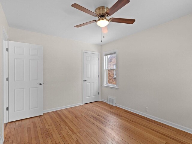 7509 W Burleigh St, Milwaukee, WI 53210 - unfurnished bedroom with a ceiling fan, baseboards, visible vents, and light wood finished floors