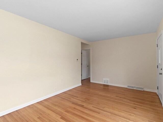 7509 W Burleigh St, Milwaukee, WI 53210 - unfurnished room featuring light wood-type flooring, baseboards, and visible vents