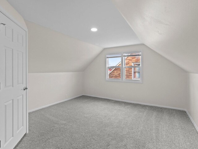 7509 W Burleigh St, Milwaukee, WI 53210 - additional living space featuring lofted ceiling, carpet flooring, and baseboards