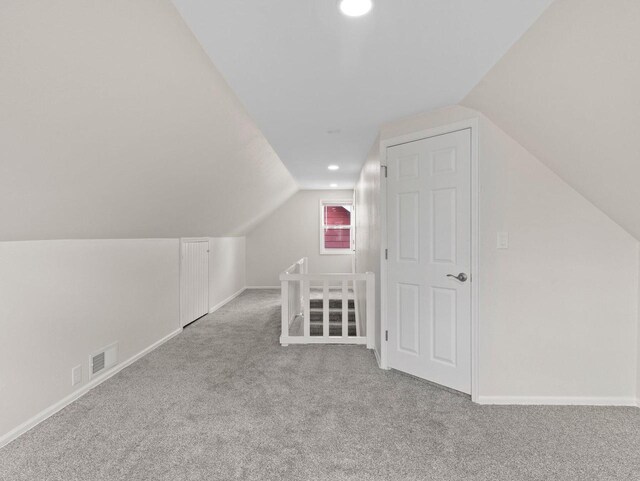 7509 W Burleigh St, Milwaukee, WI 53210 - bonus room with recessed lighting, vaulted ceiling, visible vents, baseboards, and carpet flooring