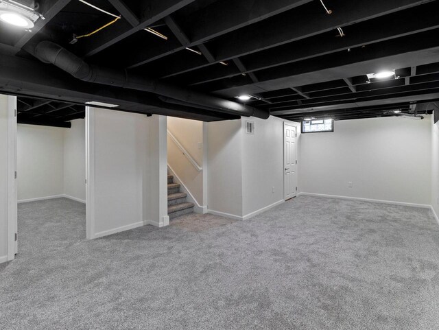 7509 W Burleigh St, Milwaukee, WI 53210 - below grade area featuring carpet floors, baseboards, and stairway