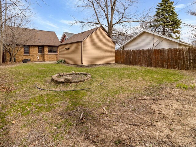 7509 W Burleigh St, Milwaukee, WI 53210 - view of yard with a fire pit and fence